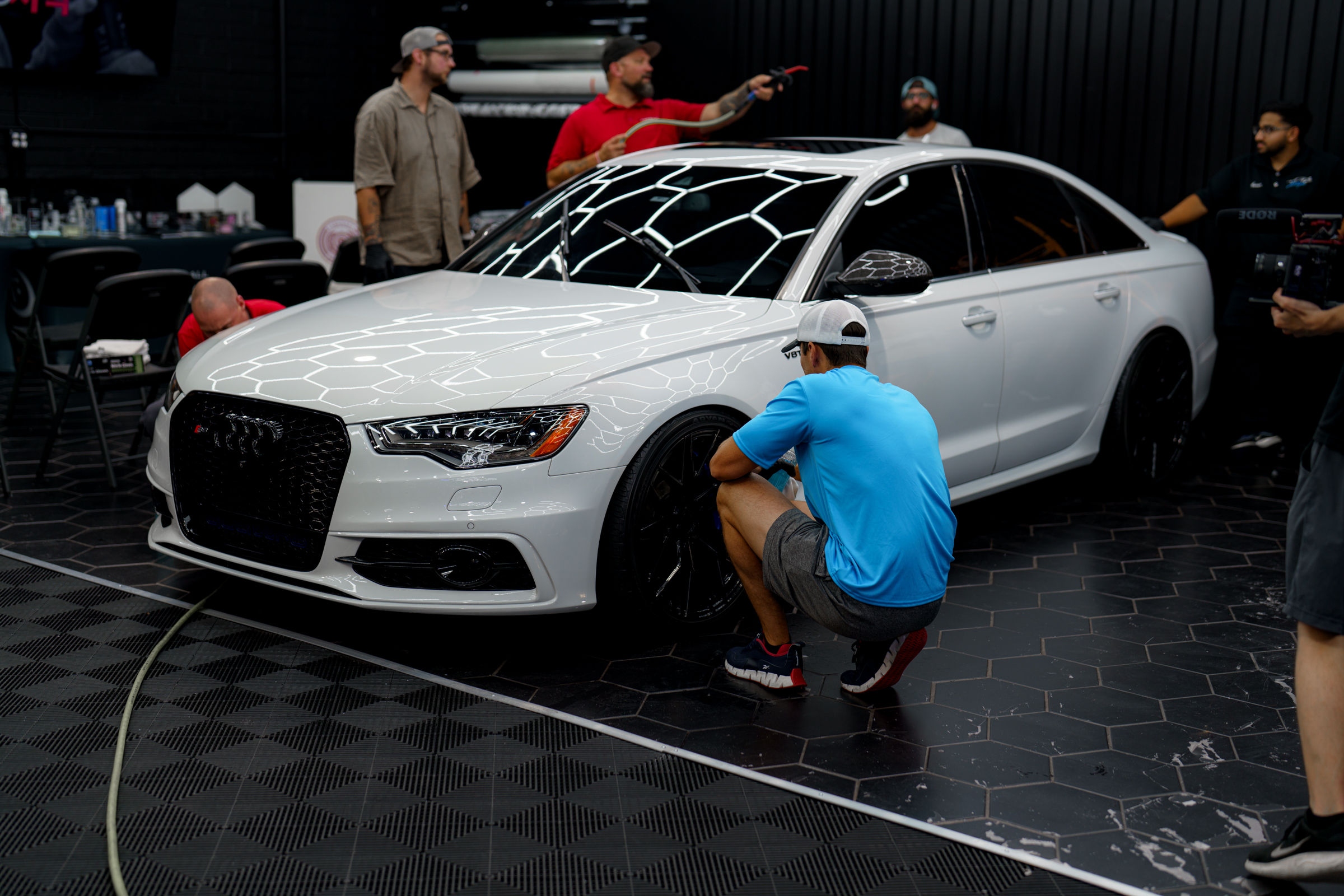 Fireball ceramic coating installers prepare to install a fireball ceramic coating on an audi