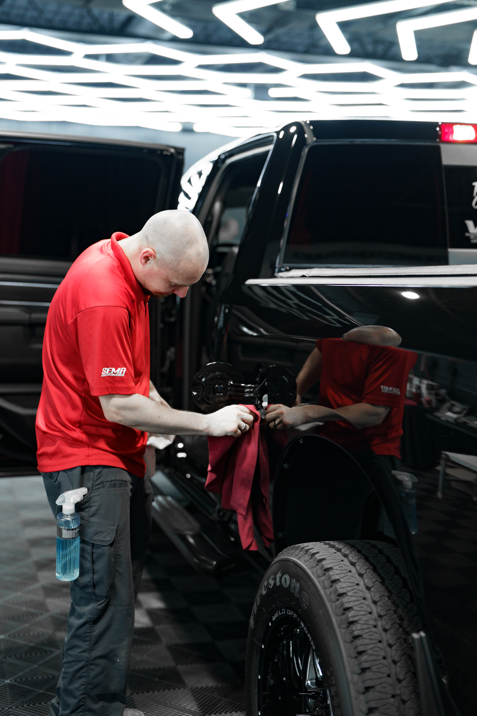 A Fireball Ceramic Coating Installer uses Fireball Detailing Product Fireball reborn to prepare a vehicle for Fireball Ceramic Coating