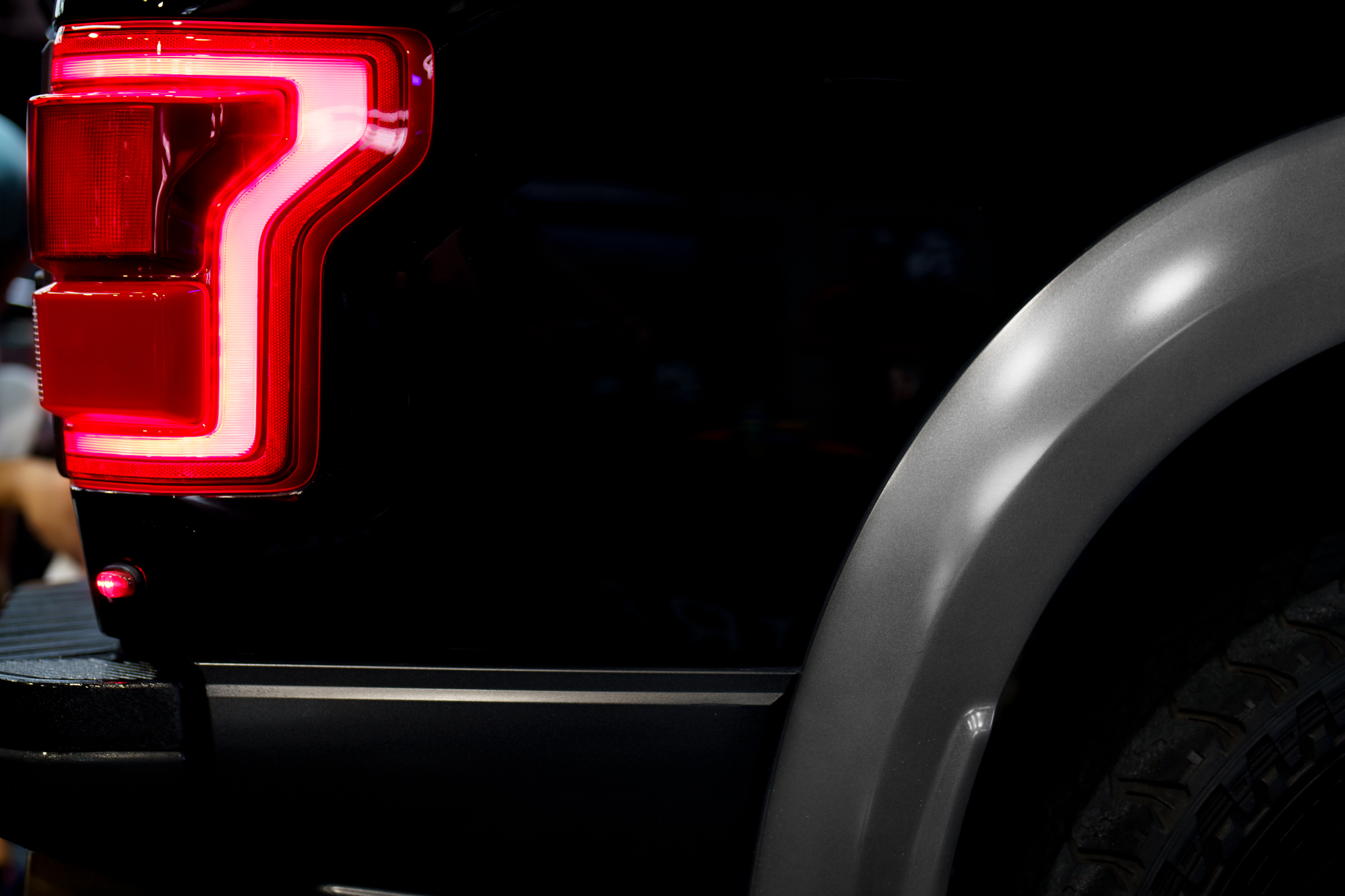 A black ford raptor prepares for a fireball ceramic coating