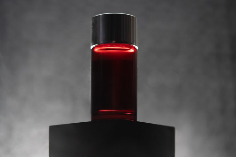 Coating bottle on a dark set